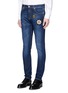 Front View - Click To Enlarge - ALEXANDER MCQUEEN - Star badge appliqué stretch jeans